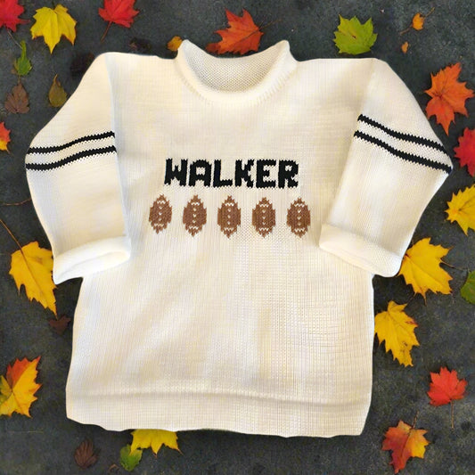 Custom football-themed baby and toddler name sweater—perfect gift for baby showers, birthdays, or sports-loving families. Soft knit, personalized design.